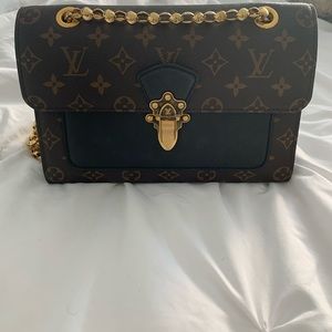 Louis Vuitton Victoire Handbag